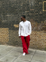 Load image into Gallery viewer, Red palm wine trousers with beige shirt
