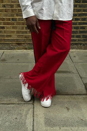 Red palm wine trousers with beige shirt